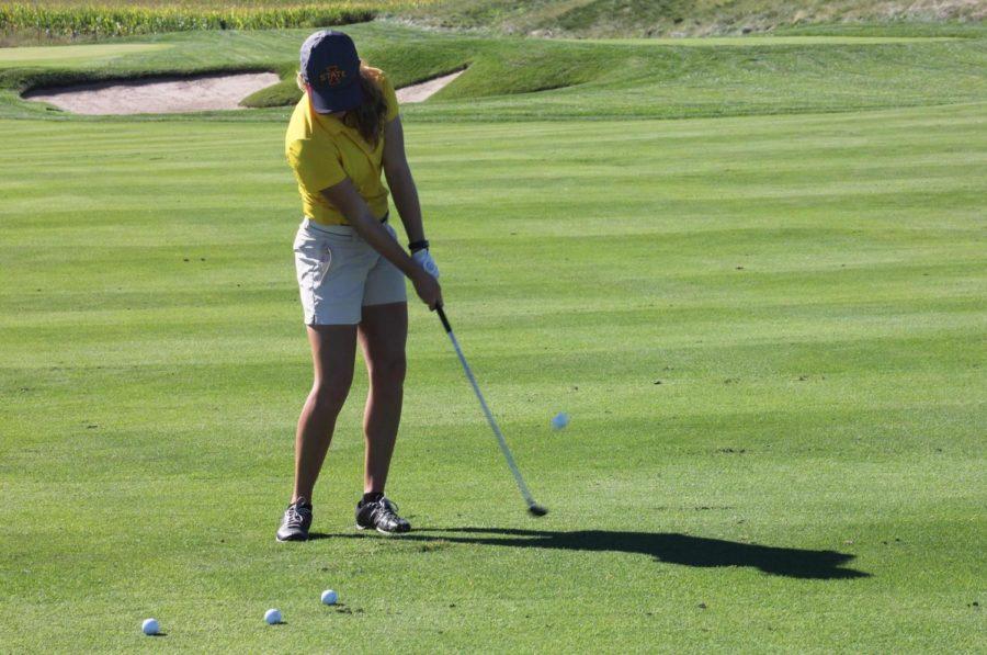 M.J. Kamin, freshman on the ISU womens golf team, practices her swing Sept. 2, 2014.