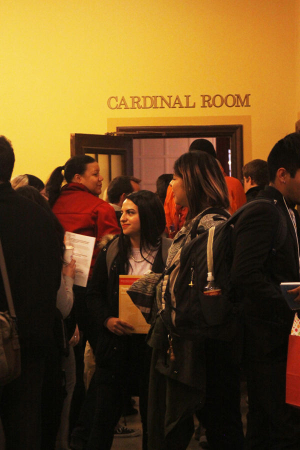 People head into the Cardinal Room at the Memorial Union on Mar. 4 at ISCORE. The session being held was called, Anyone know where I can cash in my white privilege points? Do I need a card? I keep hearing I have this, but I’m not sure where to go or how to use it. It was held at 3:10.