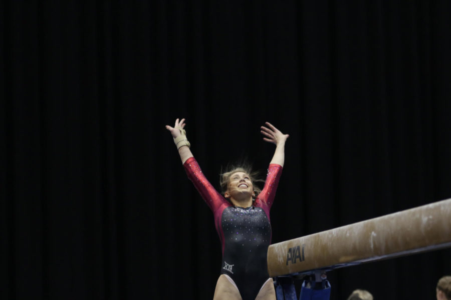 Alex Marasco, senior, salutes the judges after finishing balance beam routine during the meet against Lindenwood and North Carolina State Jan. 23. Marasco would go on to earn a 9.875 for the event. 