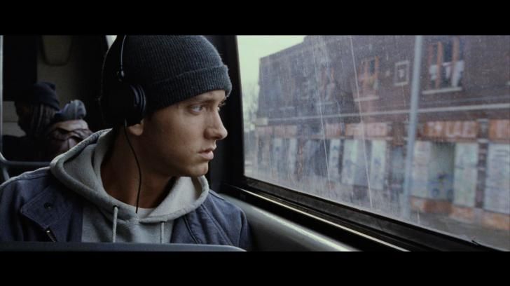 Jimmy B-Rabbit Smith (Played by Eminem) rides the bus in 8 Mile, (2002) a semi-biographical drama based off of rapper Eminems early life.
