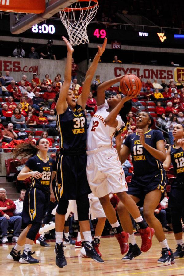Junior Seanna Johnson goes up for a layup during a game against the West Virginia University Mountaineers, March 1 in Hilton Coliseum. The Cyclones would go on to lose 82-57.