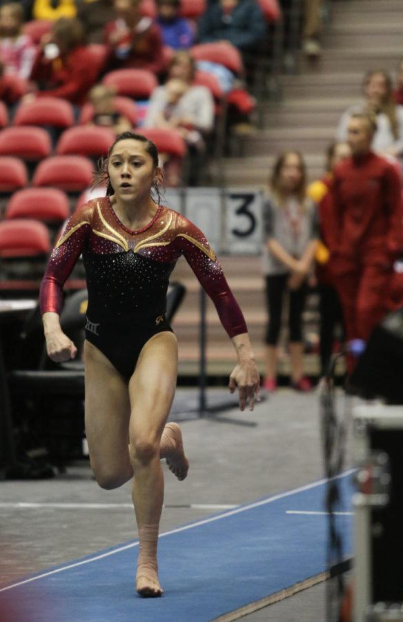 Sophomore Briana Ledesma sprints down the runway during her vault routine at the meet against the University of Iowa March 4. Ledesma scored a 9.8, contributing to the Cyclones narrow 196.025-196.0. win over the Hawkeyes.