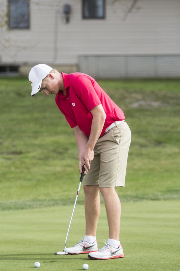 Sophomore golfer Nick Voke lines up a putt at practice on April 14. At the 2015 Gopher Invitational, Voke led the ISU mens golf team by tying for 3rd place out of 81 golfers.