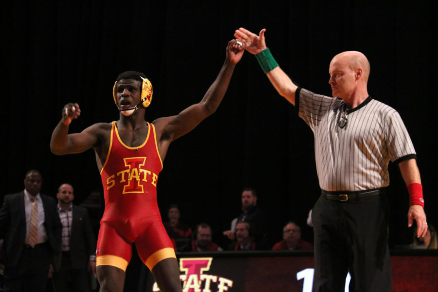 Senior Earl Hall is declared the winner of his match in the dual against West Virginia held at Hilton Coliseum in Ames, IA. At 133 lbs Hall registered four takedowns against Cory Stainbrook. Hall won the match 10-5.