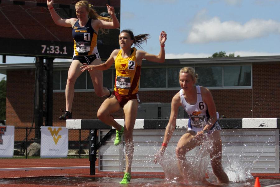 Freshman Abby Caldwell jumps into the water during the 3,000-meter steeplechase at the Big 12 Outdoor Championship on May 17, 2015 at the Cyclone Sports Complex in Ames.