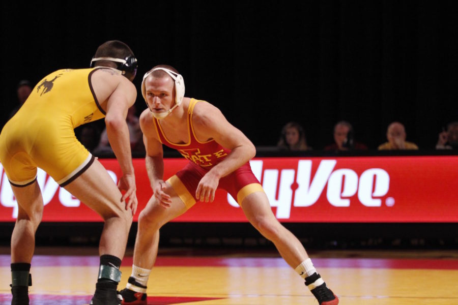 Kyle Larson, redshirt junior, faces an opponent from the University of Wyoming at Hilton Coliseum on Dec. 12.