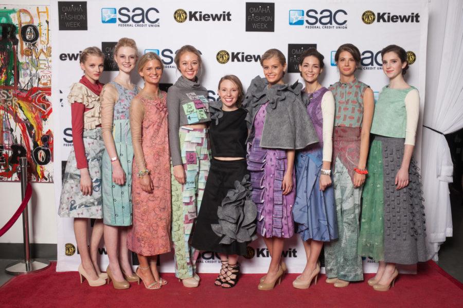 Kate Bruce (middle) poses with models from Omaha Fashion Week.