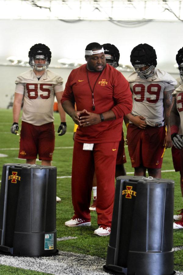 Defensive line coach Eli Rasheed coaches defense at the first football practice of the season on March 8. This is his first season coaching at Iowa State. Rasheed worked with Matt Campbells staff at Toledo for seven seasons.