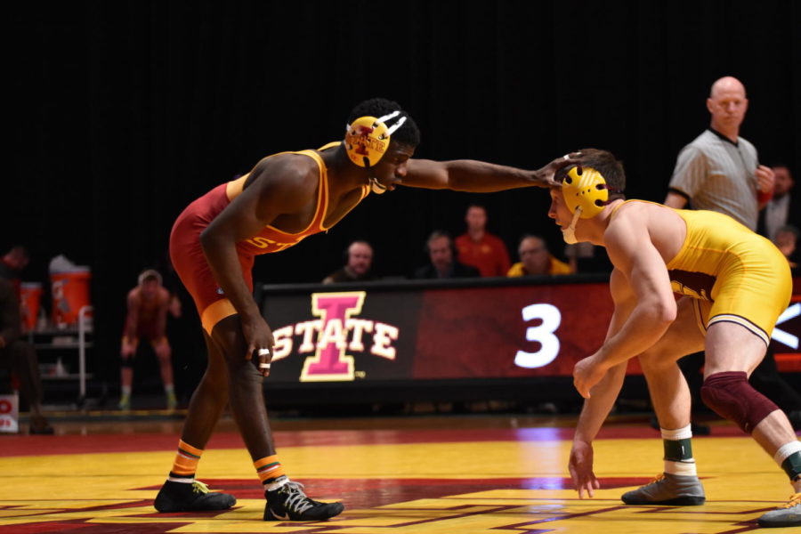 Earl Hall, senior, defeated his opponent from Central Michigan 6-2 on Jan. 31. ISU won 25-12.