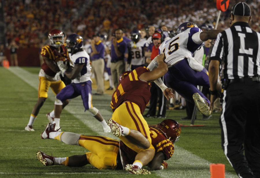 Gabe Luna sends UNI quarterback Aaron Baily flying out of bounds during Iowa States season opener at Jack Trice Stadium on Saturday, Sept. 5. The Cyclones defeated the Panthers 31-7.