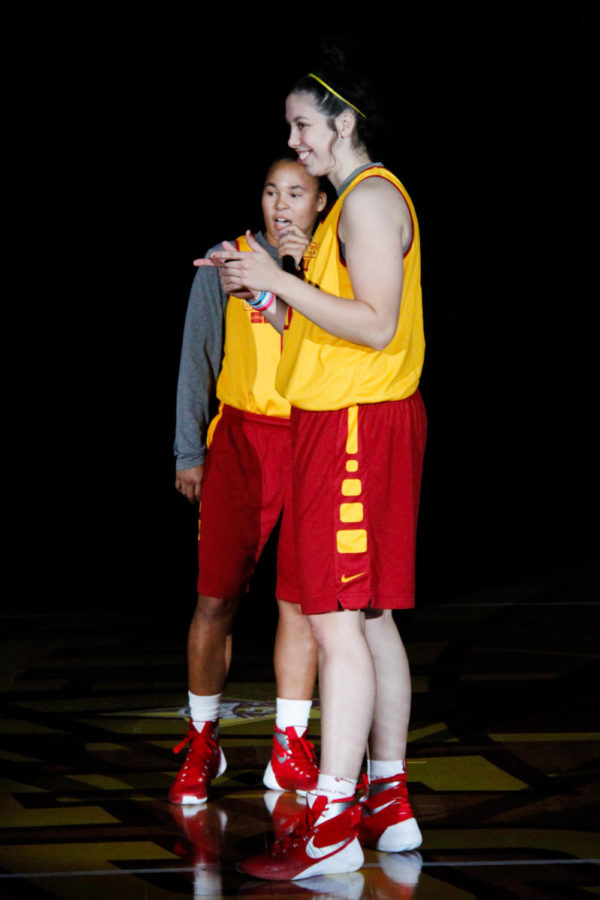 Seniors Nicole Kidd Blaskowsky, left, and Madison Baier say a few words in the opening ceremony of Hilton Madness on Oct. 16 in Hilton Coliseum. 