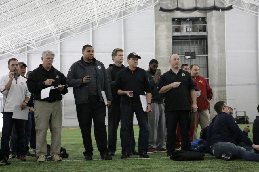 NFL scouts time Jamison Lalk during the 40-yard dash at Pro Day in the Bergstrom Football Complex March 22. Former Cyclones Quenton Bundrage, Oni Omoile, Qujuan Floyd, Sam Richardson (QB) Kenneth Lynn, Jamison Lalk, Dale Pierson, Wendell Taiese, and Sam Richardson (DB) were all being looked at. 