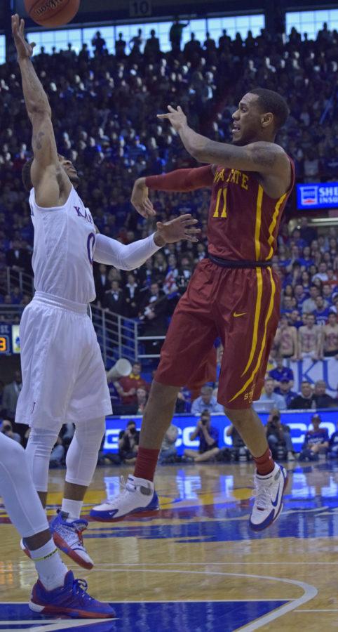 Monte Morris tries to pass the ball against Kansas on March 5, 2016 at Phog Allen Fieldhouse in Lawrence, Kansas.