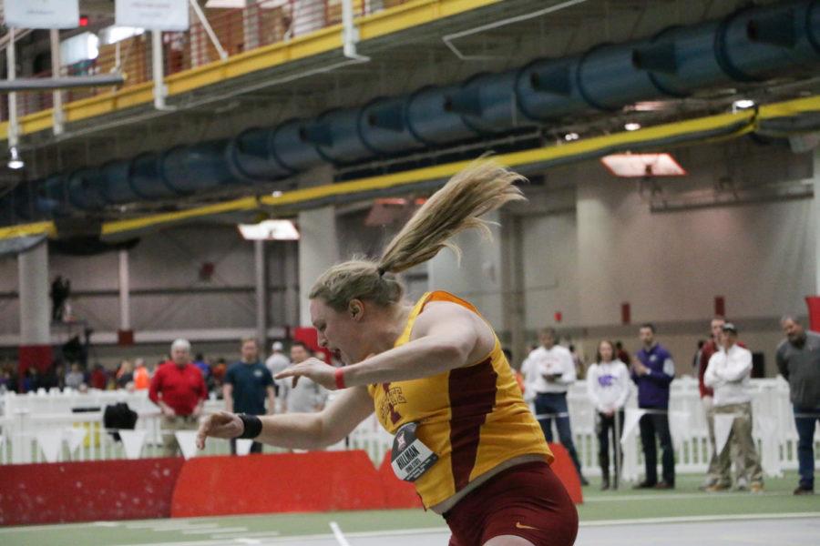 Senior Christina Hillman throws the shot during the womens shot put finals at the Big 12 Indoor Championships at the Lied Rec Center on Feb. 27. Hillman placed first with a best throw of 17.93 meters. 