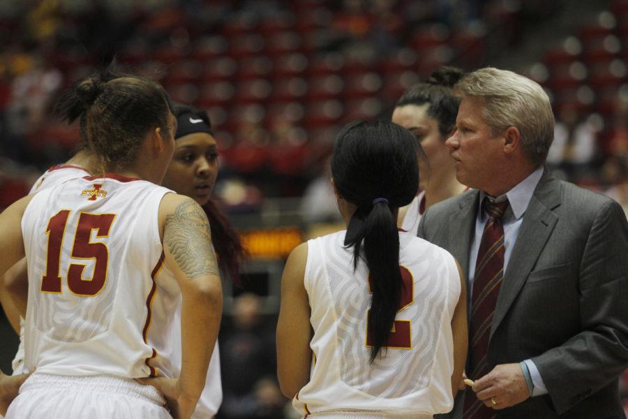 ISU head coach Bill Fennelly talks to his team after senior guard Nikki Moody was given a technical foul during the championship game of the Cyclone Challenge on Dec. 30.
