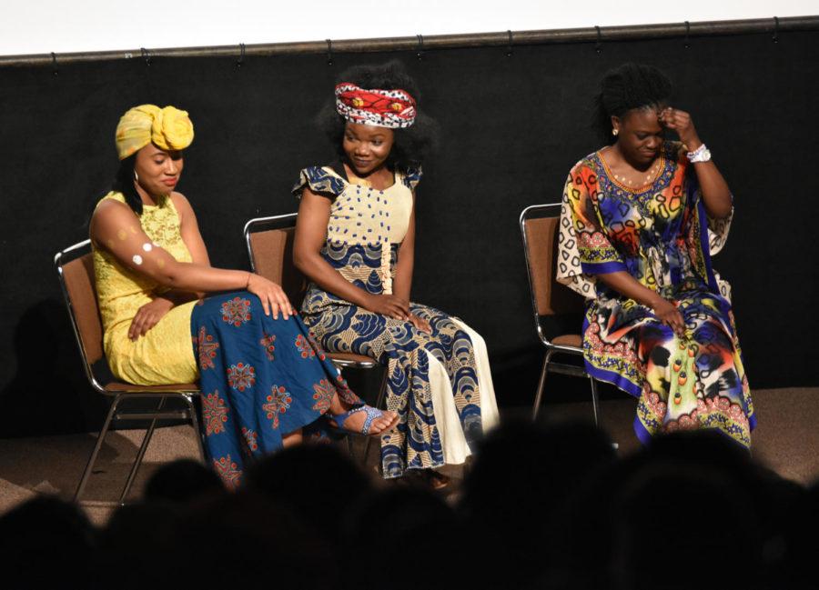 Willi Jacques, Kpandi Lumeh and Helen Yiga discuss their next move in the play at African Night on April 16. African Students Association hosted the event to join cultures together.