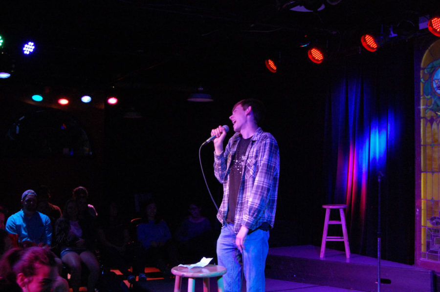 Alex Karnish, freshman in biology, performs a comedy set at Comedy College on April 19.