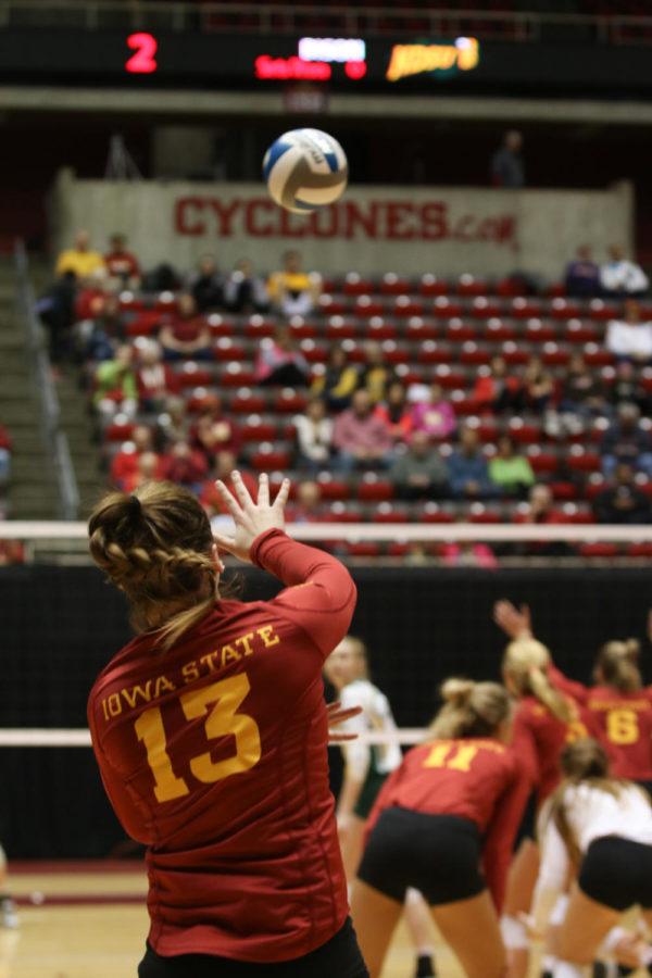 Junior Branen Berta serves the ball during the game against North Dakota State University April 9. The Cyclones hosted the Iowa State Spring Volleyball Tournament, where they defeated the University of Iowa, NDSU, and Creighton. The Cyclones tied with the University of Northern Iowa. 