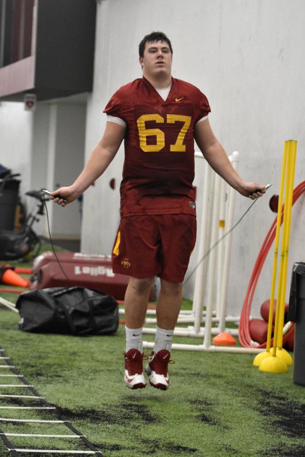 Offensive lineman Jake Campos practices on the sidelines at the first practice of the season on March 8. Campos was one of the five players to start all 12 games last season.