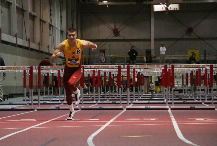 Freshman Wyatt Rhoads runs toward the finish line during the 60-meter hurdles as part of the mens heptathalon at the Big 12 Indoor Championships held at the Lied Rec Center on Feb. 27. Rhoads placed ninth with a time of 8.74 seconds.
