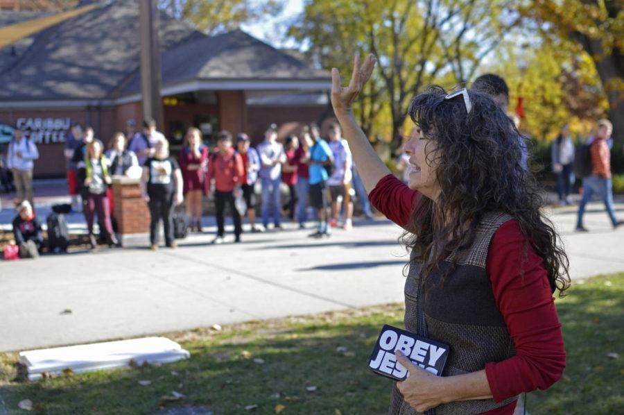 Sister Pat of Campus Ministry USA speaks to students in the free speech zone outside Parks Library Nov. 2.