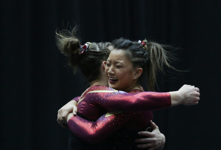 Freshmen Sydney Converse and Meaghan Sievers celebrate the Cyclones' narrow 196.025-196.0 victory over the Hawkeyes March 4. 