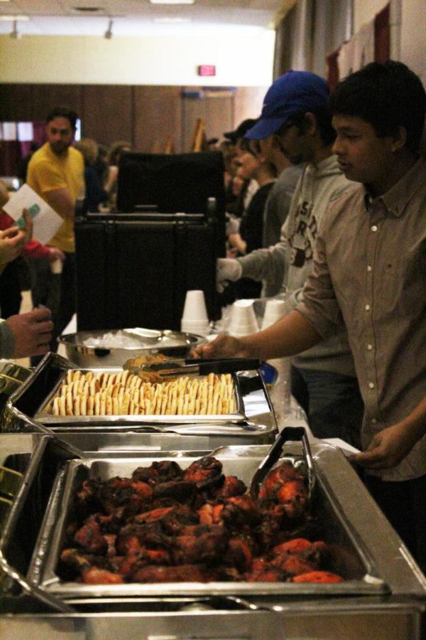 The Bangladesh Student Association serves food at the International Food Fair. The event took place on Apr. 3 in the Memorial Union.