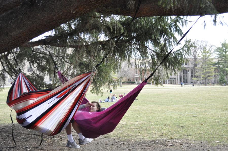 Students+lounge+in+hammocks+while+others+sprawl+on+the+lawn+of+Central+Campus+on+the+afternoon+of+March+8%2C+2016.