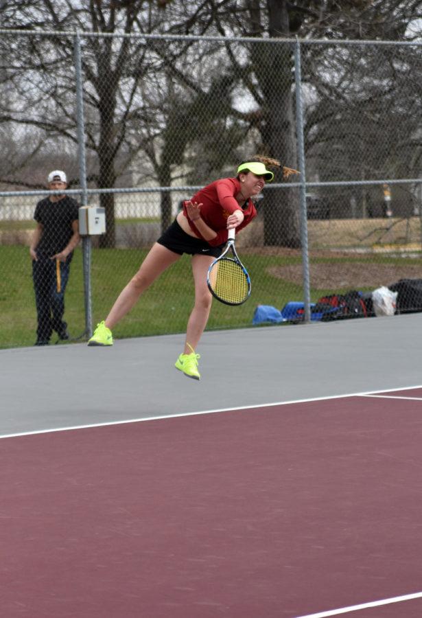 Iowa State freshman Annabella Bonadonna jumps for the tennis ball at the match against Kansas on April 10. The Cyclones fell 4-2. Bonadonna ranked first nationally in her age group in 2011 and 2013 before attending ISU.
