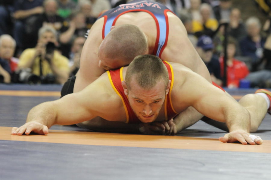 Former Iowa State wrestler Jake Varner straddles Ohio States Kyle Snyder in the championship match. Varner would win the first match, but lose the next two matches to place runner-up in the 97 kilogram weight bracket on April 10 in Iowa City, Iowa. 