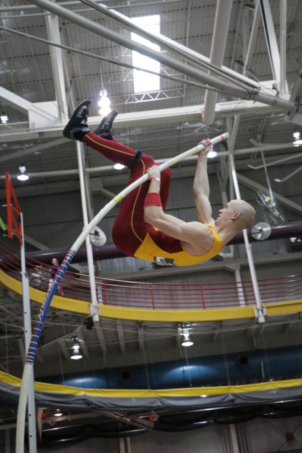 Senior Taylor Sanderson clears the bar during the pole vault as part of the mens heptathalon at the Big 12 Indoor Championships held at the Lied Rec Center on Feb. 27. 