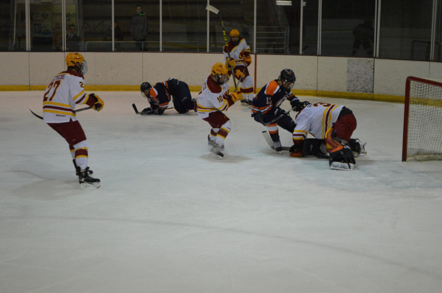 Iowa State hockey team defends their net in a competitive game against University of Illinois.