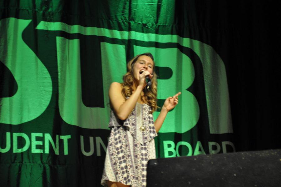 Miranda Merryfield, freshman in interdisciplinary studies, sings Tough Lover from the show Burlesque Thursday, April 14, at Cyclone Voice in the Memorial Union, an event put on by the Student Union Board. 