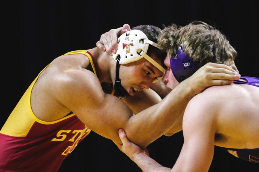 Marcus Harrington, a redshirt sophomore at Iowa State, grapples with Northern Iowa's Chase Shedenhelm at Hilton Friday night.