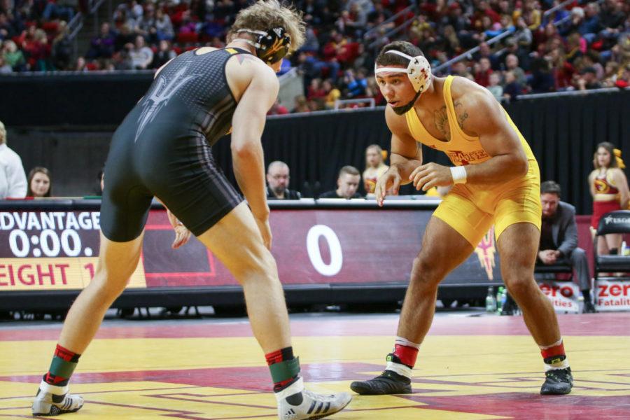 Marcus Harrington wrestles during the Cyclones Beauty and the Beast meet against Arizona State Jan. 6. Harrington lost the match 3-2. 