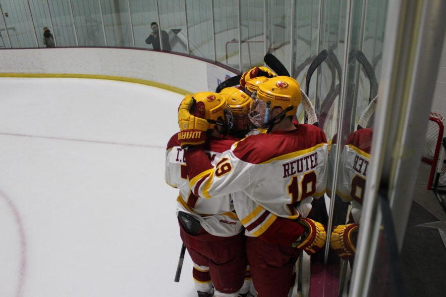 The Cyclones celebrate a goal against the University of Colorado on Friday night. The Cyclones won 8-6.