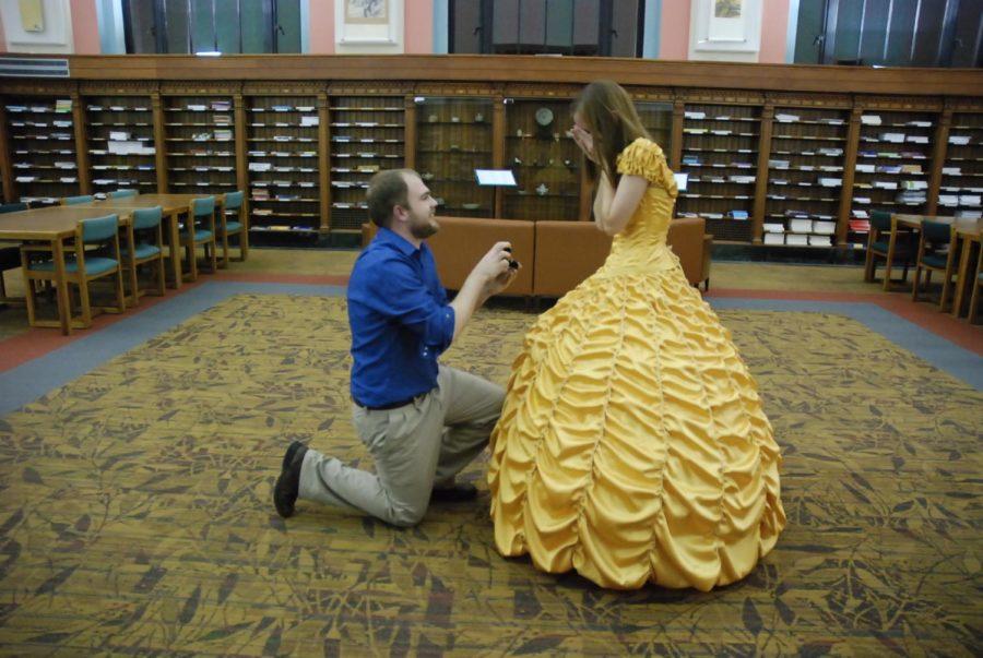 Joel Lynch proposes to Cara Szymansky in the Periodical Room of Parks Library.