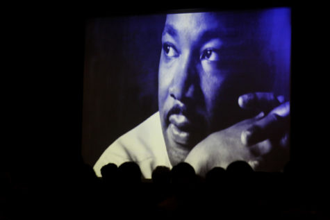 At the Freedom Riders: Documentary and Discussion, the audience watches intently as the documentary touches on Martin Luther King Jr.s involvement in the Civil Rights Movement and connects his actions to the Freedom Riders cause. 