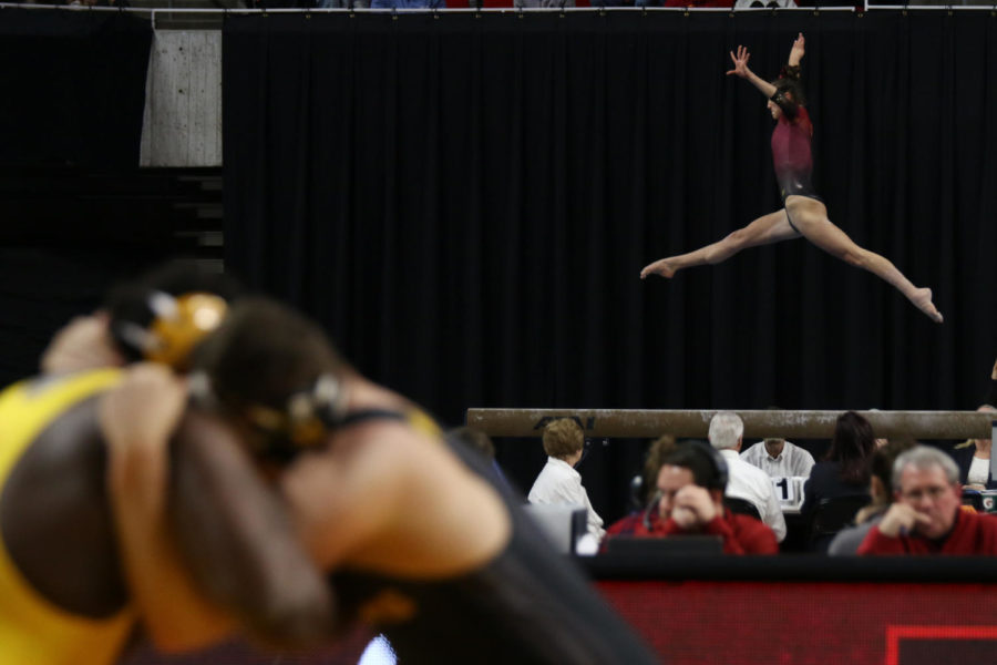 Arizona State's Katelyn Lentz performs her beam routine Jan. 6. The Cyclones hosted the Sun Devils at Hilton Coliseum for simultaneous gymnastics and wrestling meets, dubbed 'Beauty and the Beast.' The gymnastics team defeated the Sun Devils 193.850-191.8, while the wrestling team lost 25-14.