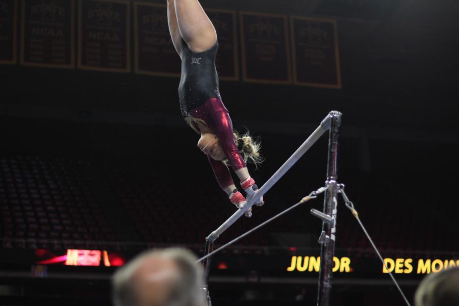 Haylee Young performs her bars routine on Jan. 13 in Hilton Coliseum during Iowa State gymnastics tri-meet on Jan. 13. Iowa State won the tri-meet against Towson and UW-Oskosh with a score of 194.275.