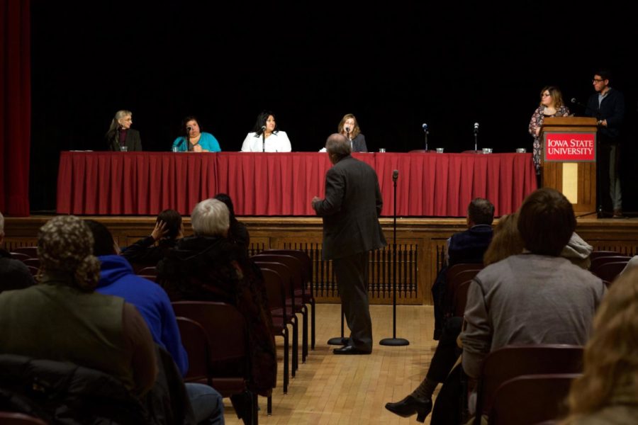 An audience member directs a question to panelists during the question and answer portion of the forum about what immigrants should do if they are arrested. The forum on immigrant's rights took place in the Great Hall of the Memorial Union on Jan. 24.