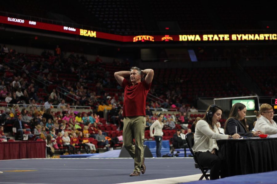 Coach Jay Ronayne reacts after a vault routine during Iowa State gymnastics tri-meet on Jan. 13. Iowa State won the tri-meet against Towson and UW-Oskosh with a score of 194.275.