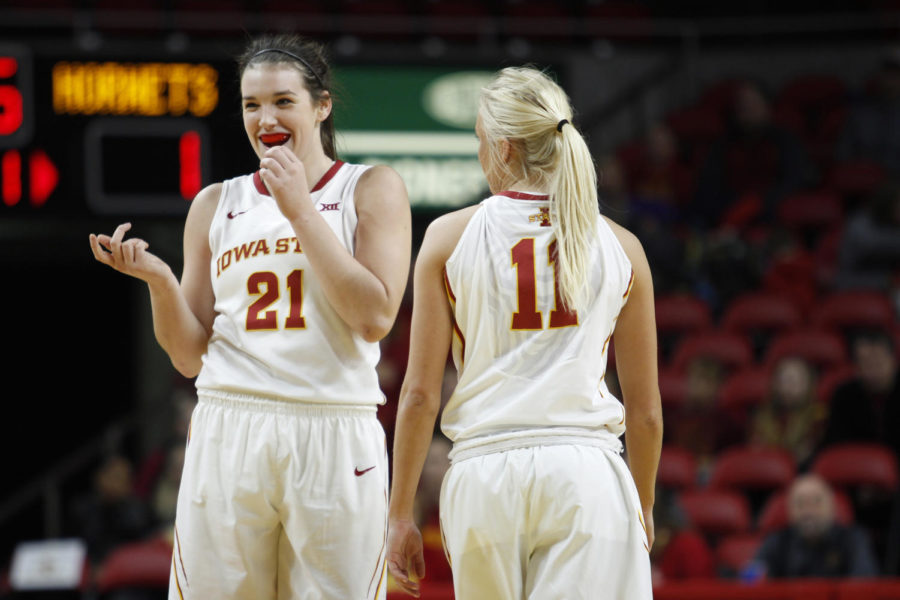 Iowa State sophomore Bridget Carleton laughs with teammate Jadda Buckley during a break in the game after making four straight 3 point shots to start the game against Delaware State.