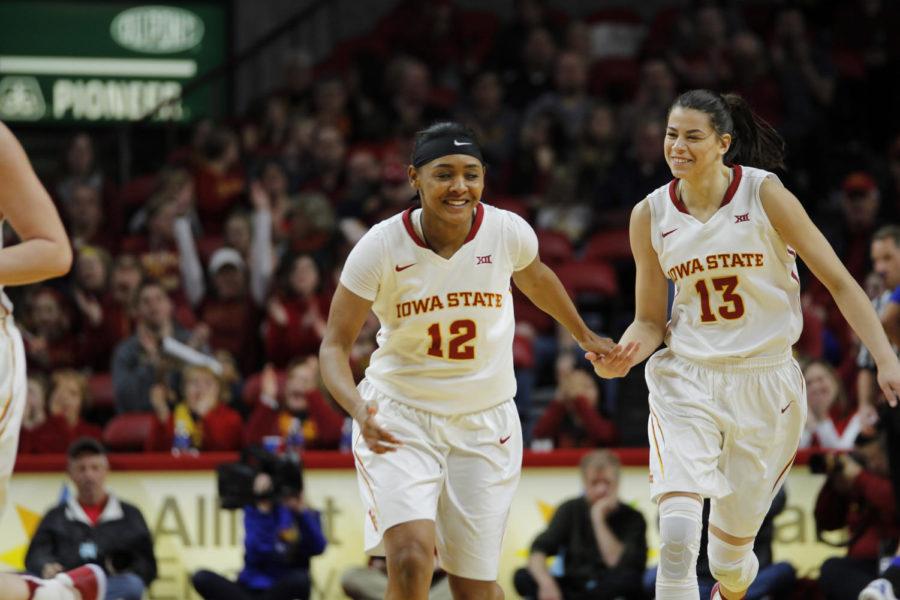 Iowa State senior Seanna Johnson and freshman Adriana Camber slap hands after a made basket in the second half against Kansas.