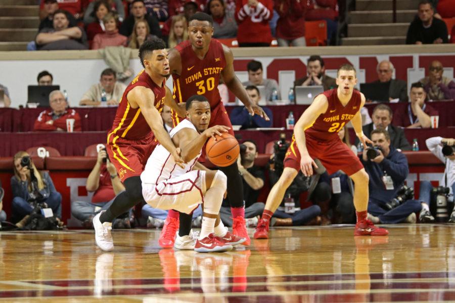 Naz Mitrou-Long (left) and Deonte Burton (right) double-team Oklahomas Jordan Woodard in the first overtime at the Lloyd Noble Center in Norman, Oklahoma, on Jan. 21, 2017. Iowa State beat the Sooners 92-87 in double overtime.