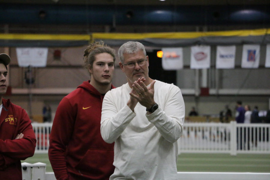 Former head football coach Paul Rhoads and son Jake Rhoads watch freshman Wyatt Rhoads compete in the pole vault competition as part of the heptathalon during the Big 12 Indoor Championships held at the Lied Rec Center on Feb. 27, 2016. 