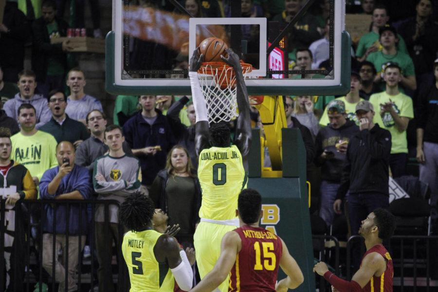 Baylors Jo Lual-Acuil Jr. slams the ball through the hoop during the game against Iowa State in Waco, Jan. 4, 2017. The No. 2 Bears won 65-63.