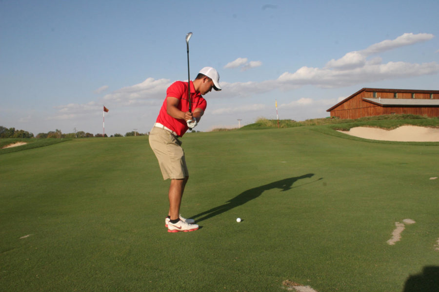 Junior Ruben Sondjaja practices his chipping for his next golf match. The Iowa State golf team practiced on October 7th, 2015 at their new course.
