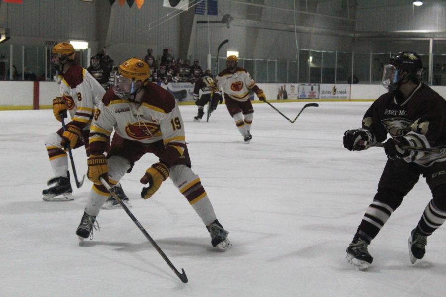 Junior defenseman Kody Reuter defends the puck against Robert Morris. Robert Morris took a one point lead in the first period.