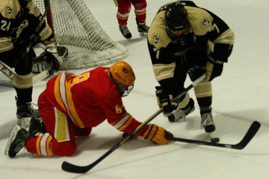 Sophomore Trevor Sabo dives for the puck in the second period. Iowa State went on to beat Colorado 3-2 on Dec. 10.